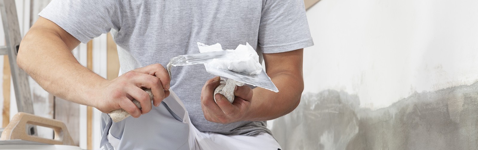 bigstock-Hands-Man-Plasterer-Constructi-406739975.jpg